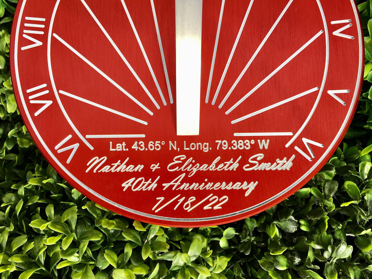 Red sundial in garden as 40th anniversary gifts for parents, the perfect 40th wedding anniversary gifts sundial.