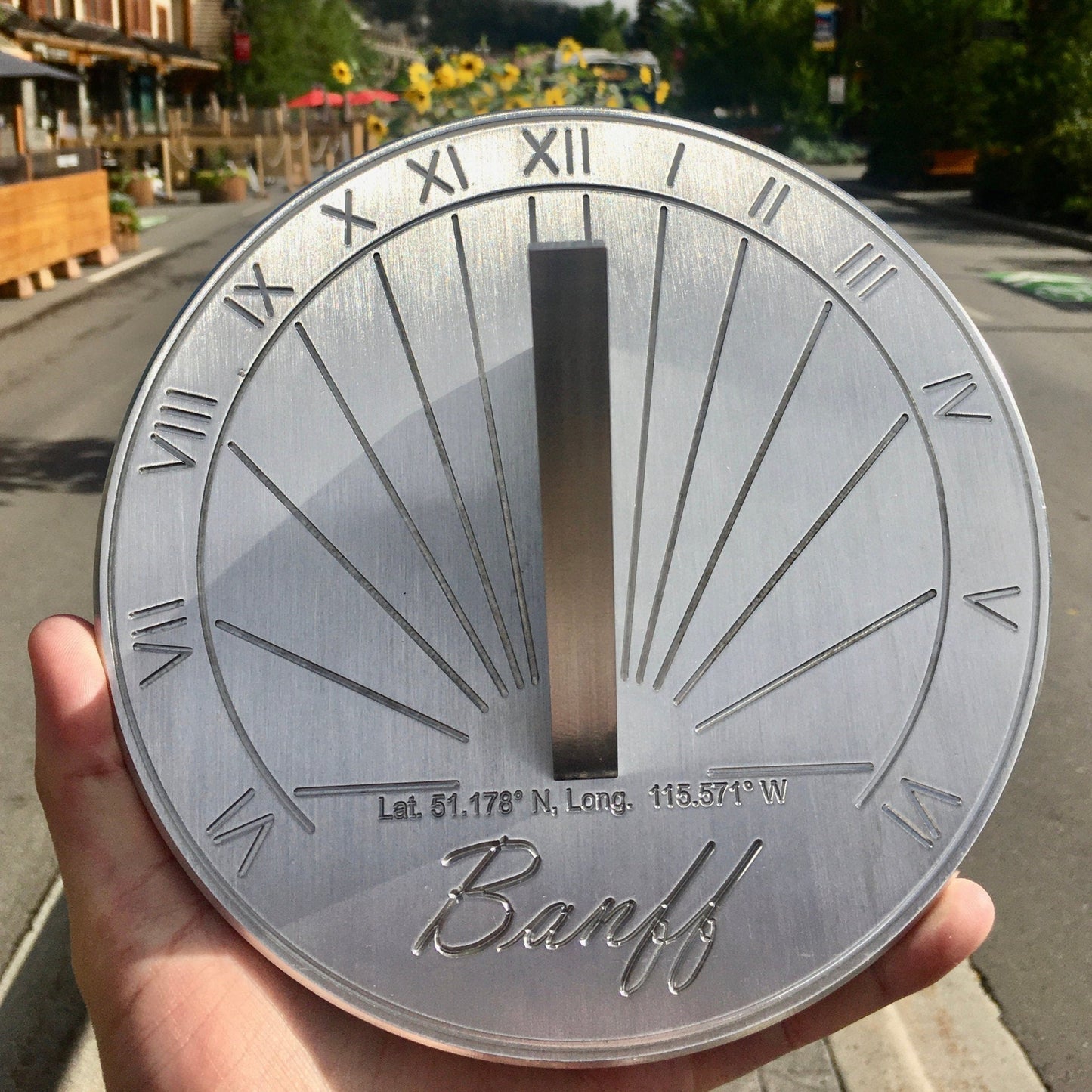 Sundial custom made garden ornament shown in Banff, Alberta, as a personal anglo-saxon sundial.