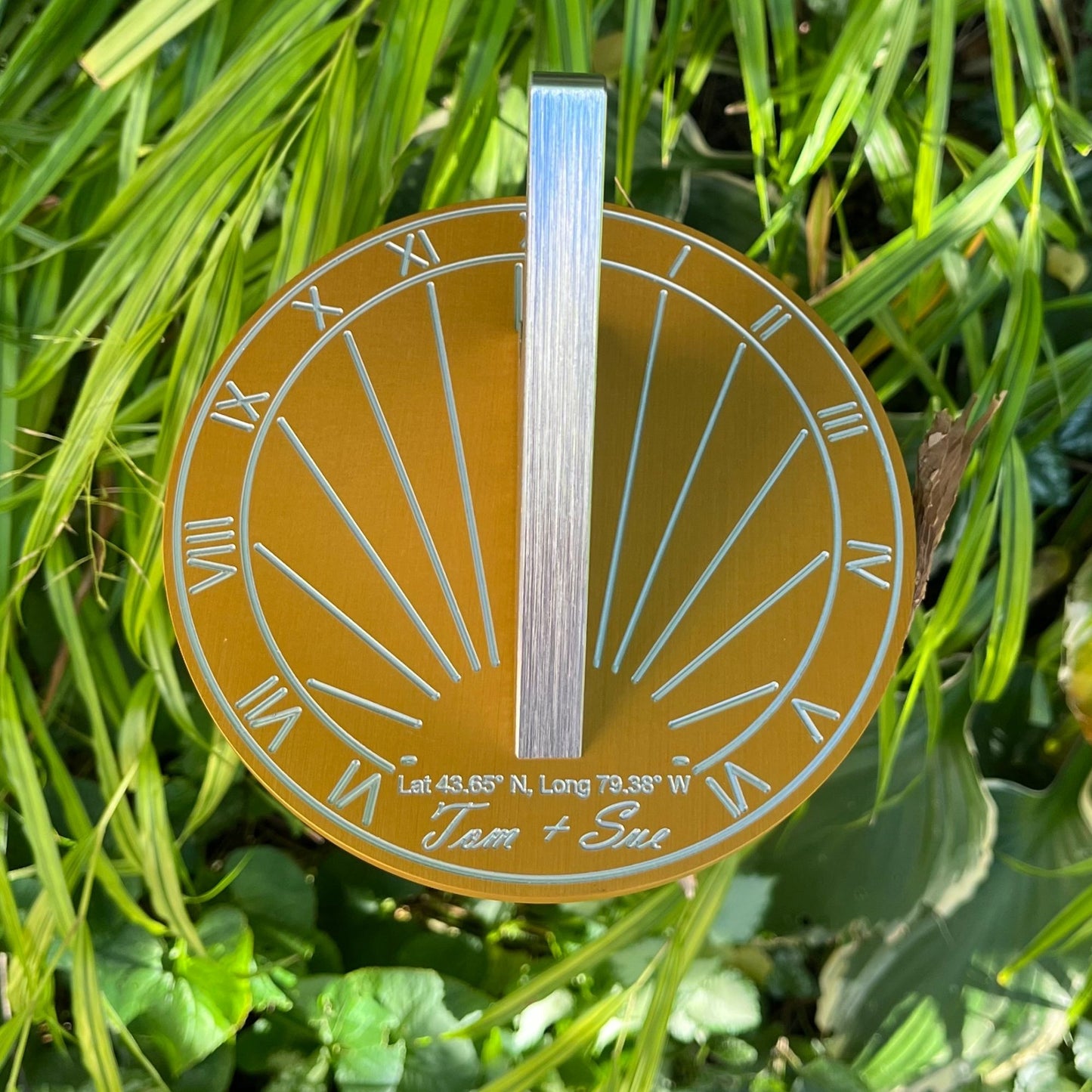 Gifts for golden wedding anniversaries sundial shown in garden on a bush as a gifts golden wedding anniversary.