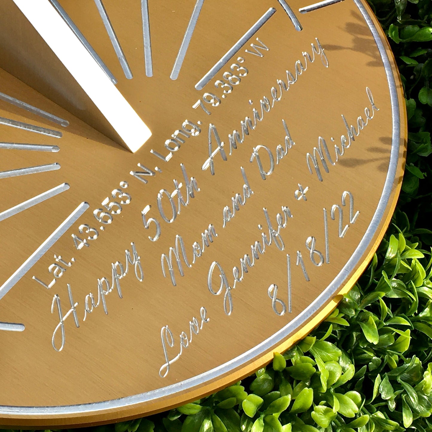 Personalized gifts for golden wedding anniversary sundial on grass, celebrating 50 years anniversary.