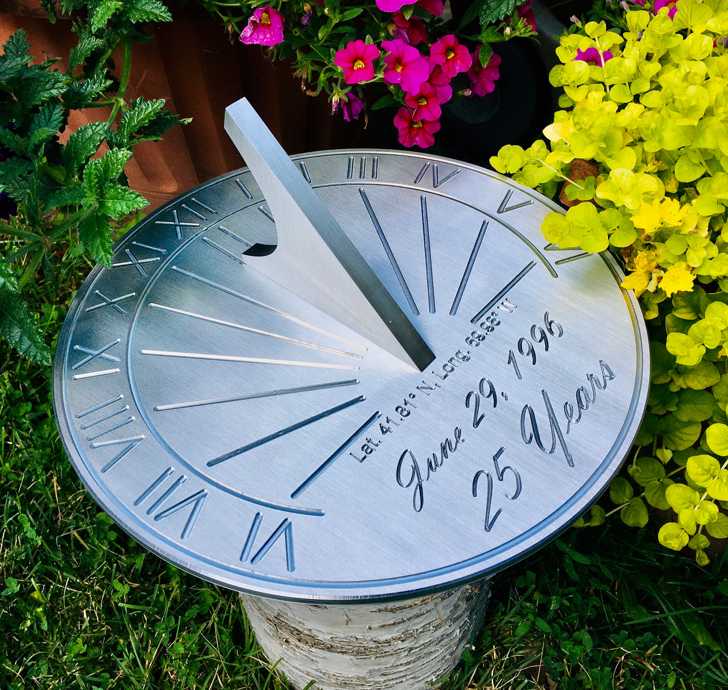 Personalized sun dial personalized sundial shown in garden with an engravable sundial compass.