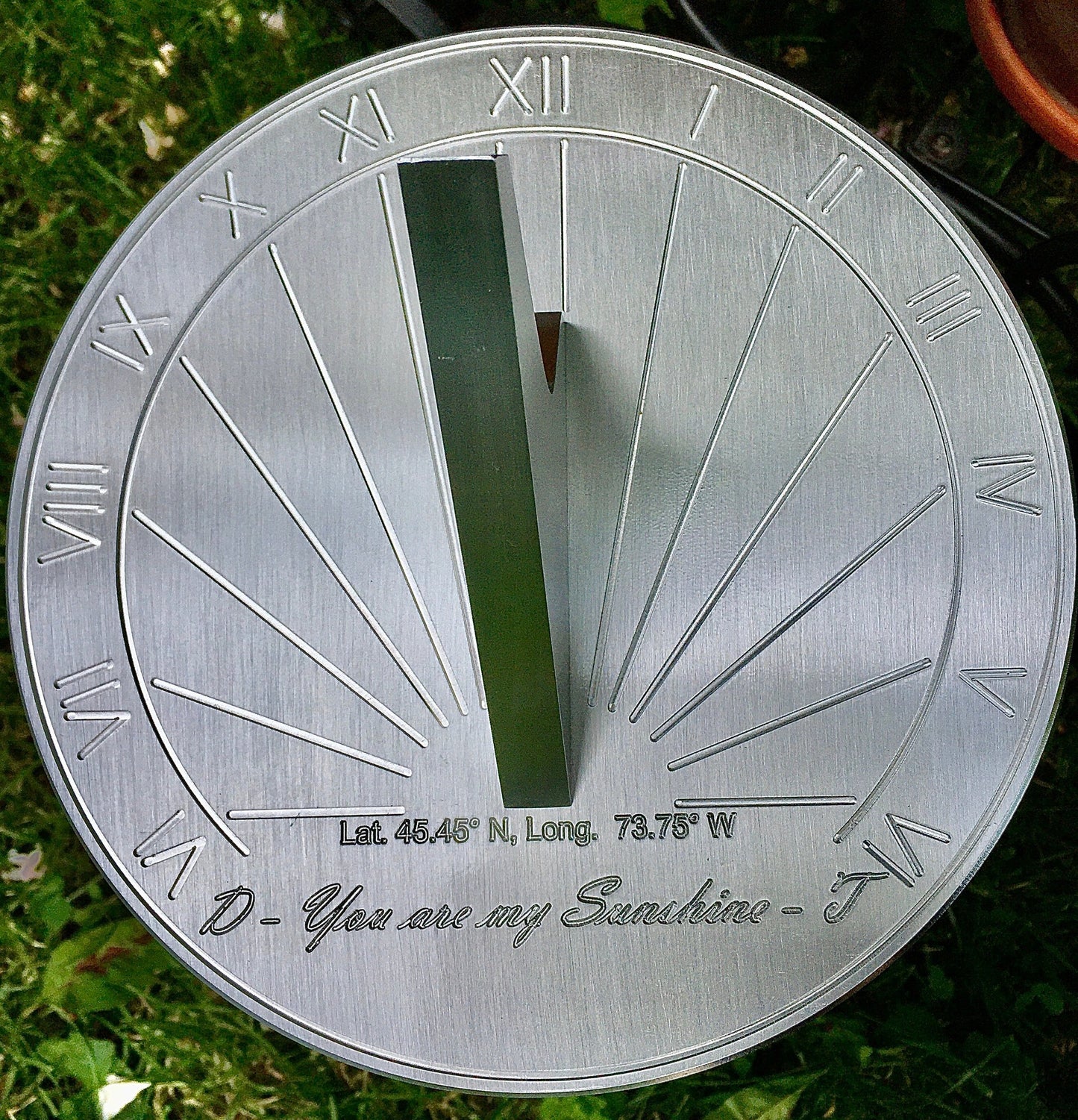 Blue sapphire wedding anniversary sundial displayed in garden as excellent gift ideas for 45th wedding anniversary friends. 