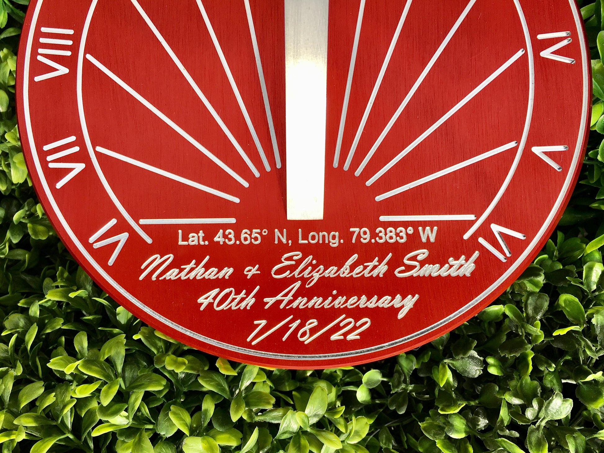 Red sundial in garden as 40th anniversary gifts for parents, the perfect 40th wedding anniversary gifts sundial. 