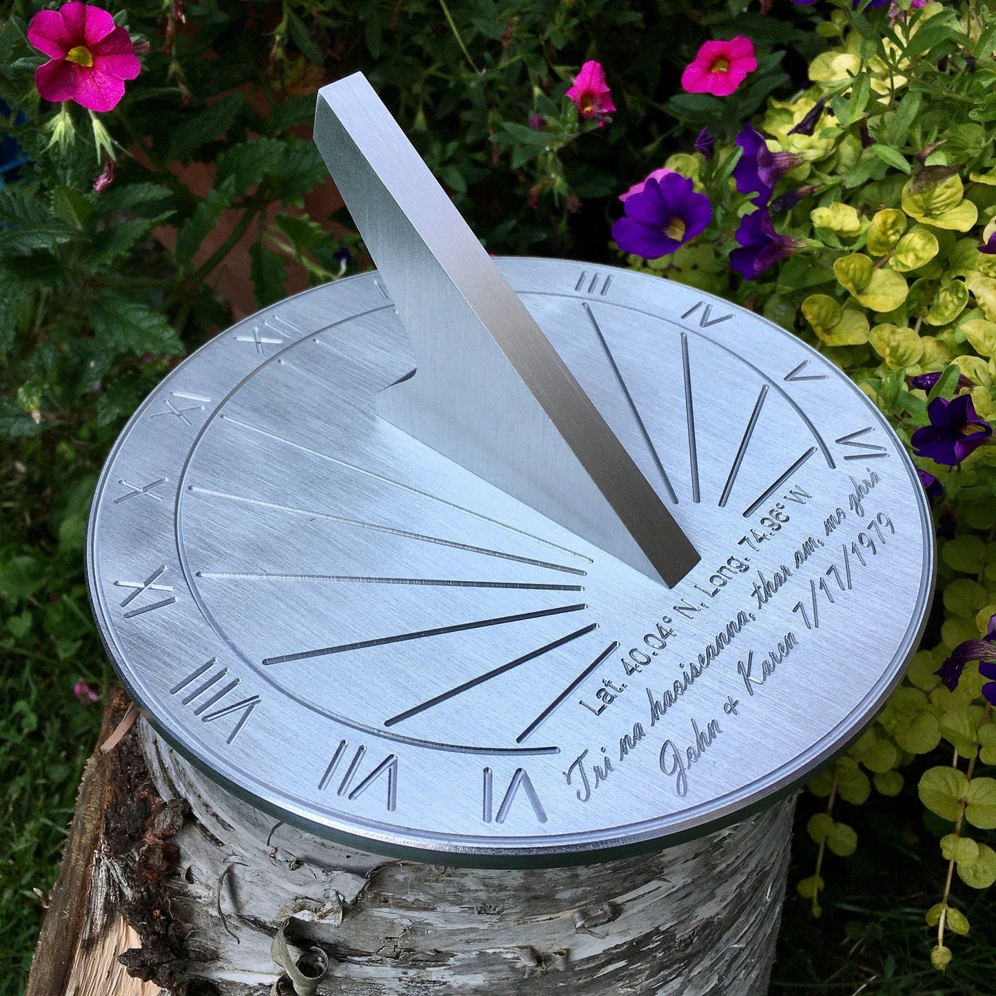 Ruby wedding gifts for wife displayed in garden, custom engraved for ruby wedding anniversary. 