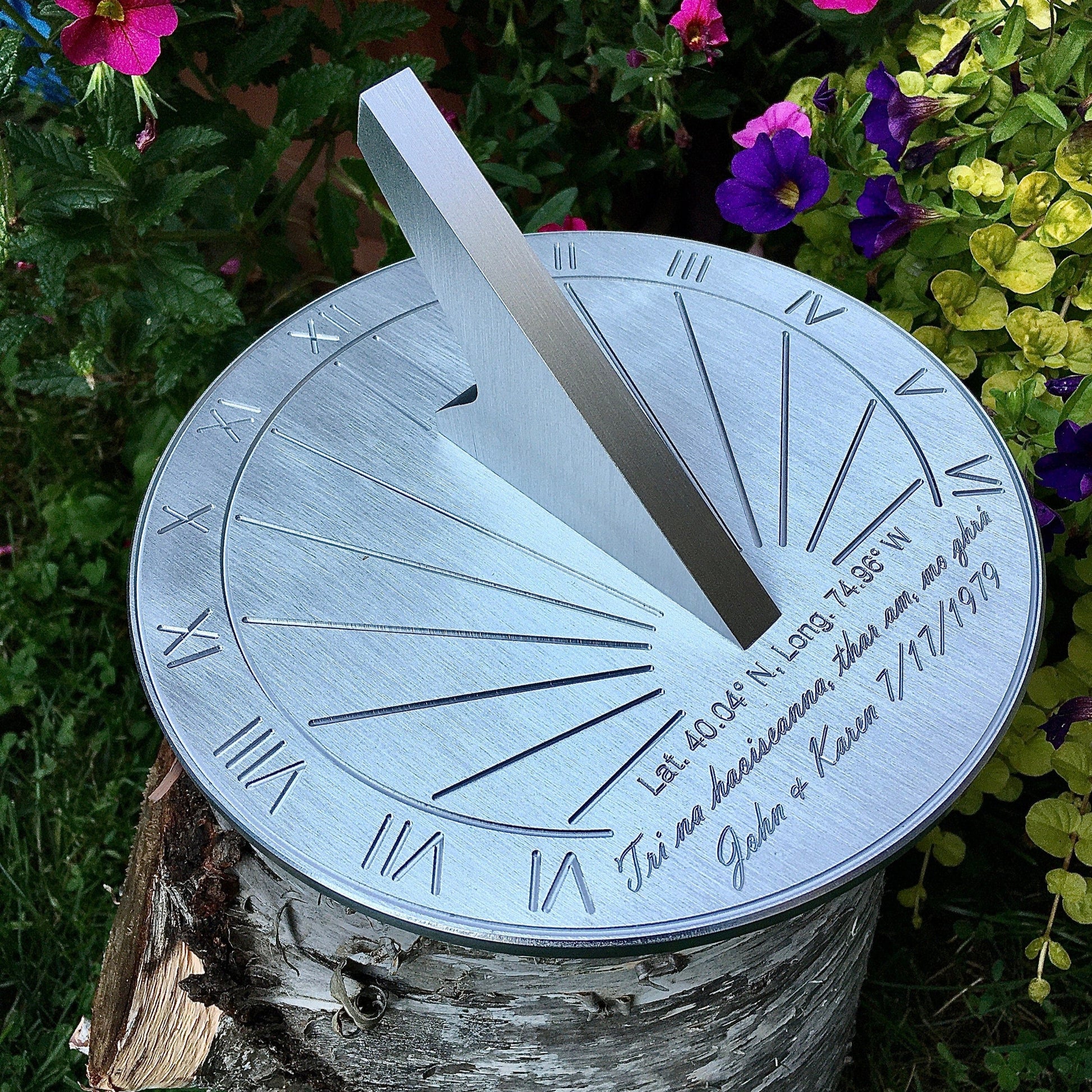 Sundial for ruby wedding anniversary gifts for friends displayed in garden for 40th ruby wedding anniversary. 