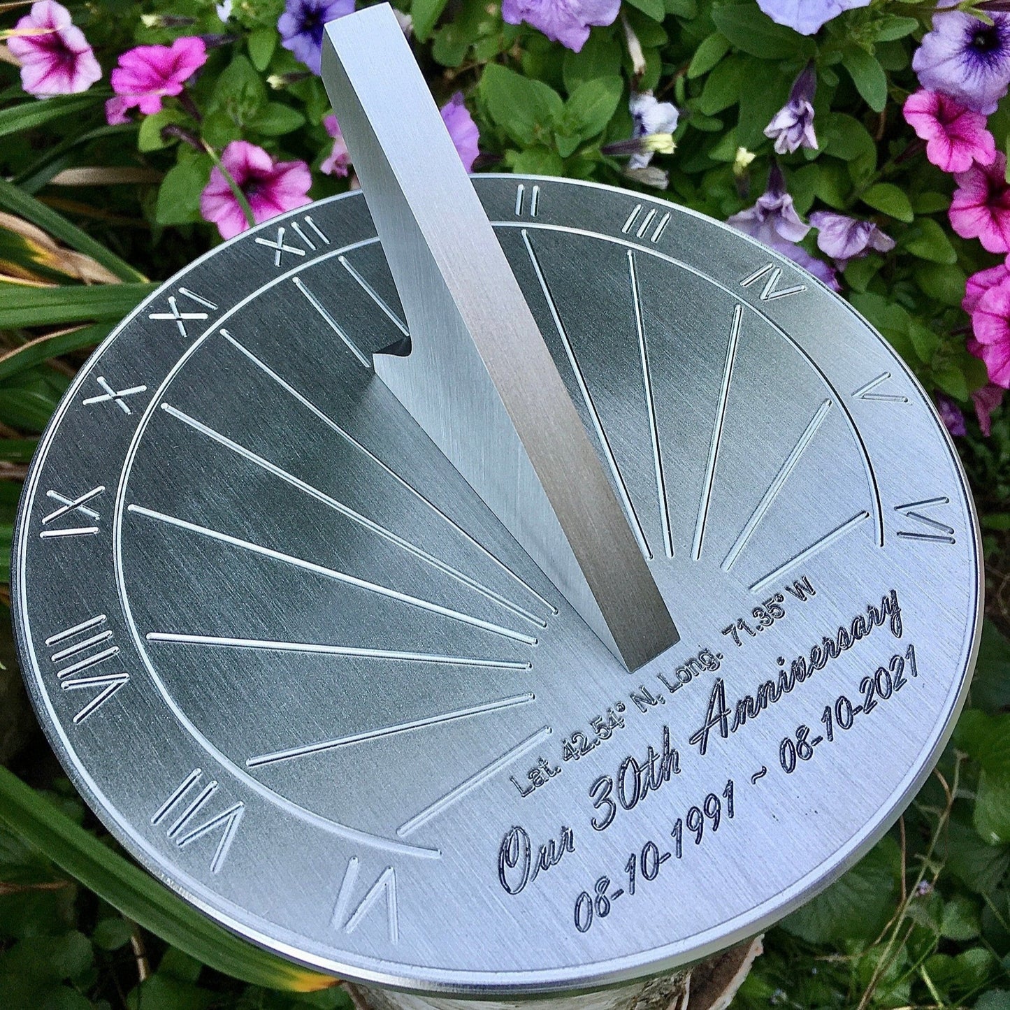 Apollo's pearl wedding anniversary gift shown in garden, surrounded by flowers, highlighting custom engraved 30th anniversary gifts. 